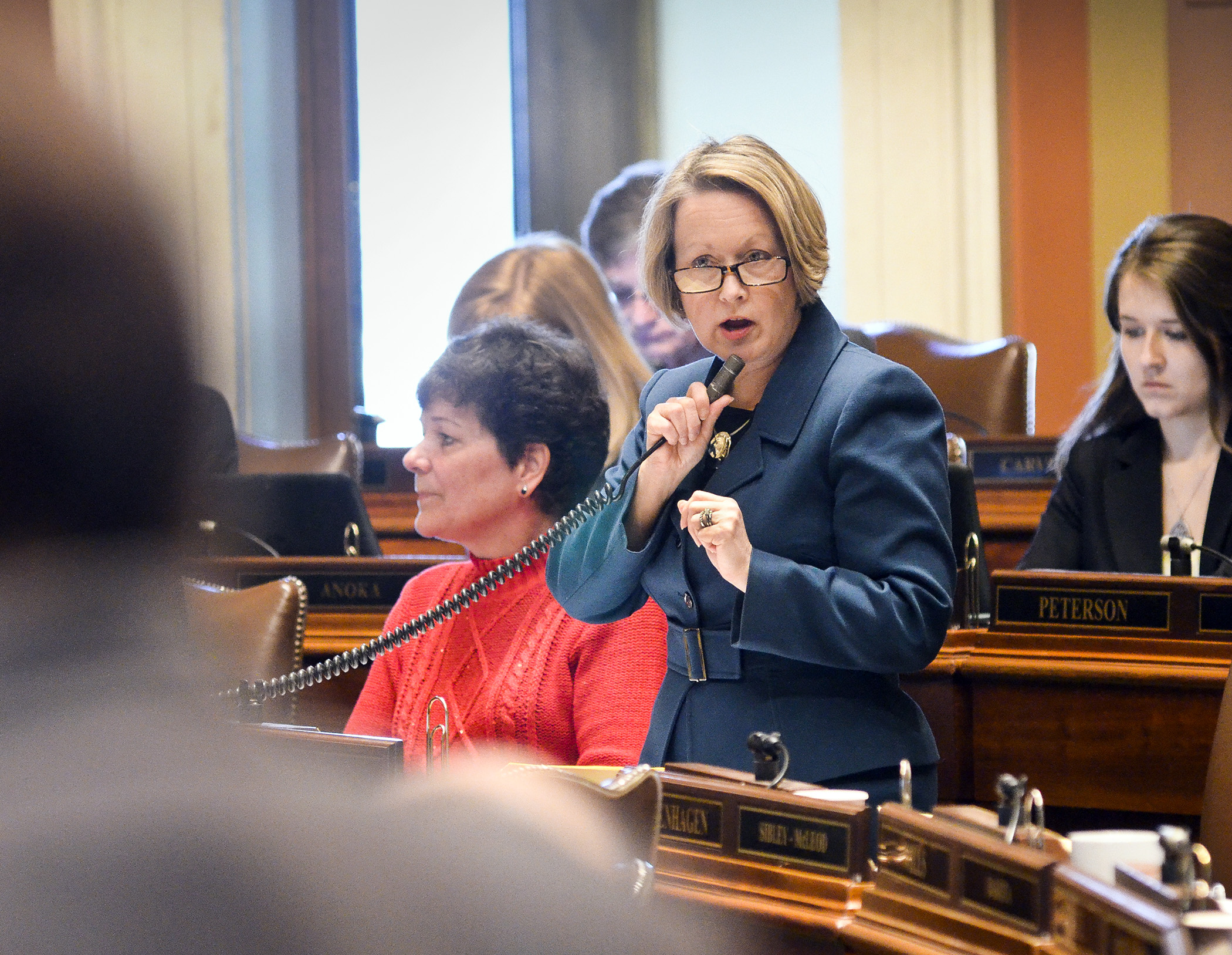 Rep. Jenifer Loon answers a question from a DFL colleague during the March 5 floor debate on HF2. Photo by Andrew VonBank